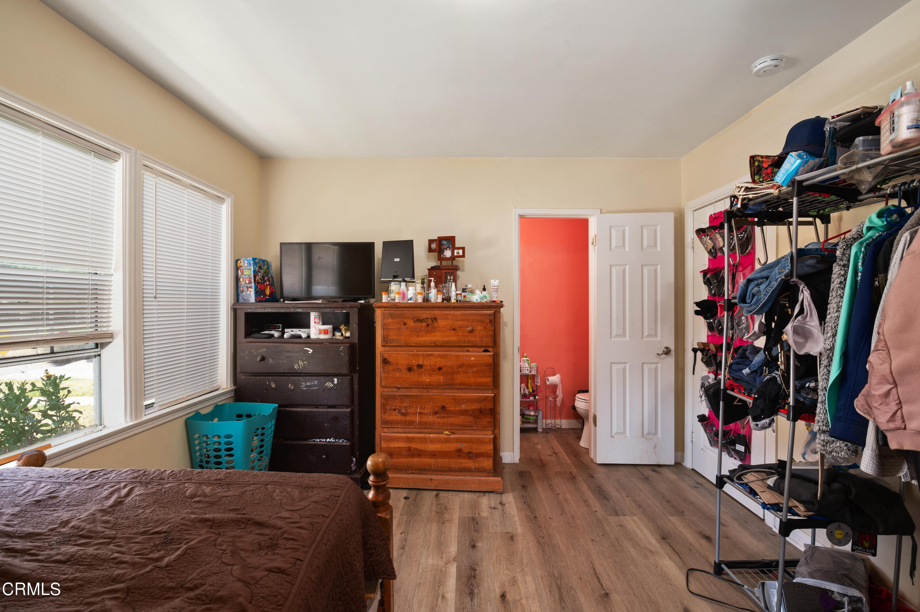 11208 Aster Street Ventura, CA 93004 - Photo 16 of 33 a bedroom with a bed and a tv