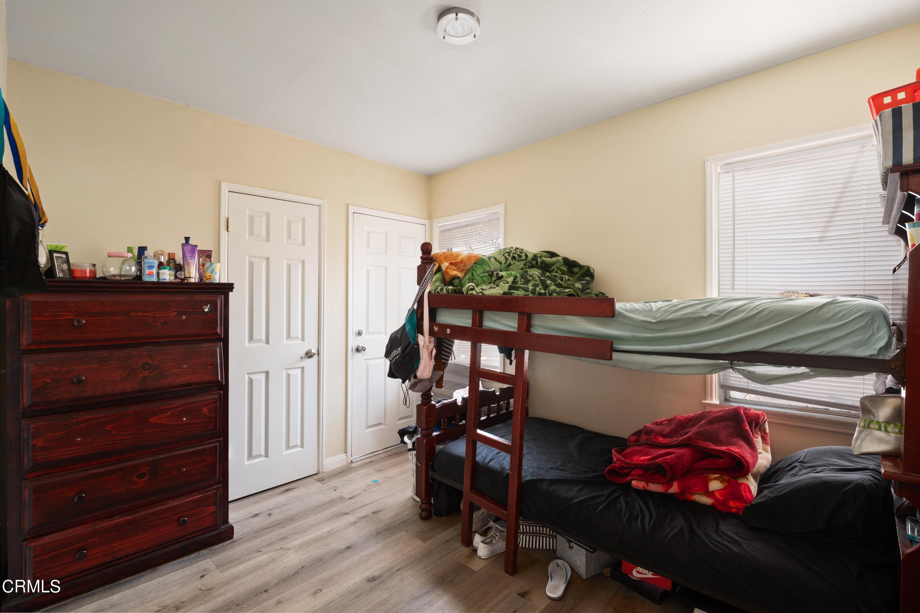 11208 Aster Street Ventura, CA 93004 - Photo 17 of 33 a bedroom with a bed and a tv