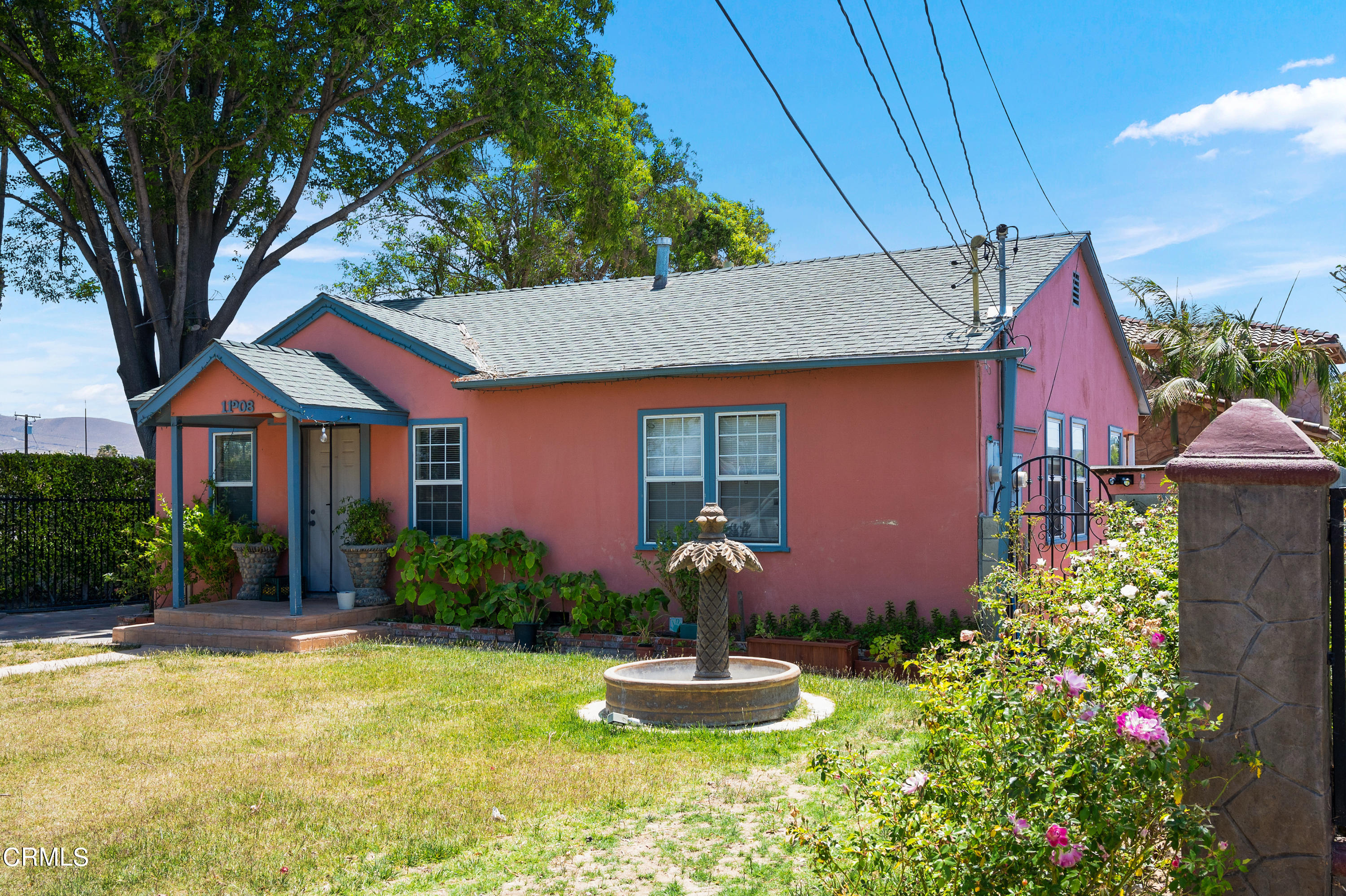 11208 Aster Street Ventura, CA 93004 - Photo 22 of 33 a front view of house with yard and green space