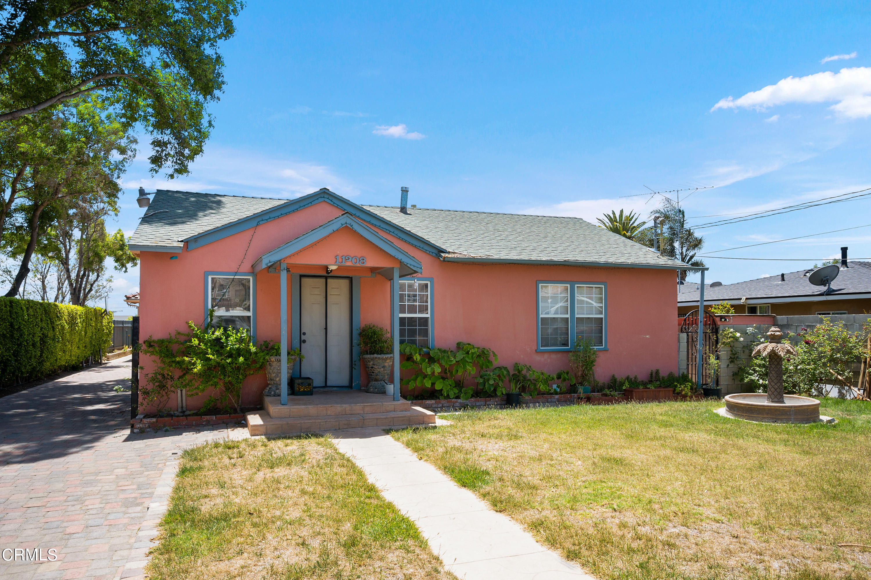 11208 Aster Street Ventura, CA 93004 - Photo 23 of 33 a front view of a house with garden