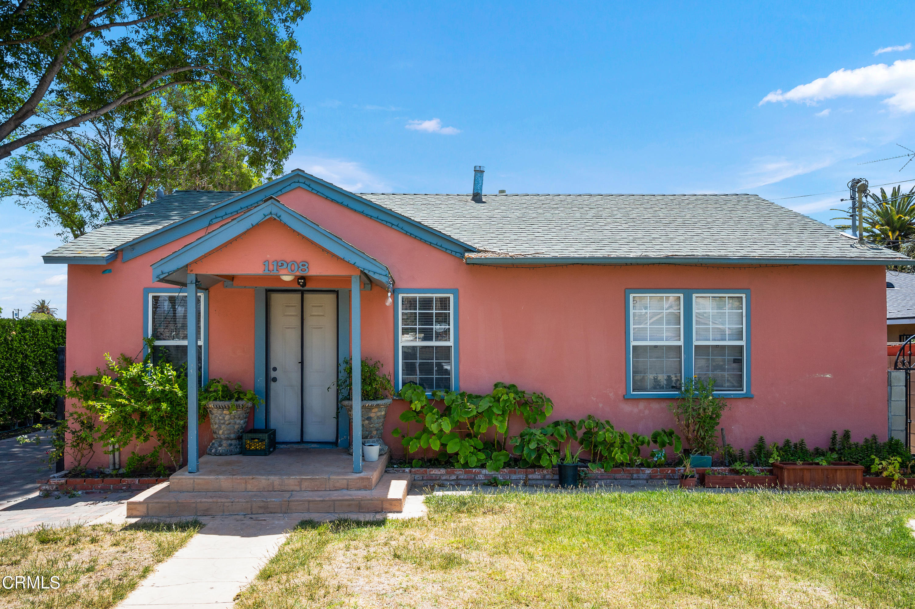 11208 Aster Street Ventura, CA 93004 - Photo 24 of 33 a front view of a house with garden