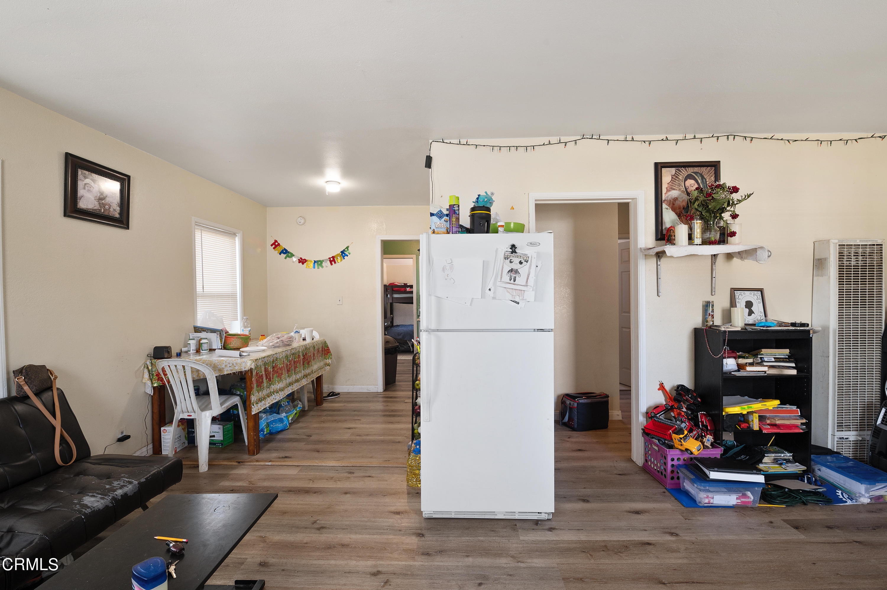 11208 Aster Street Ventura, CA 93004 - Photo 4 of 33 a living room with furniture and a wooden floor