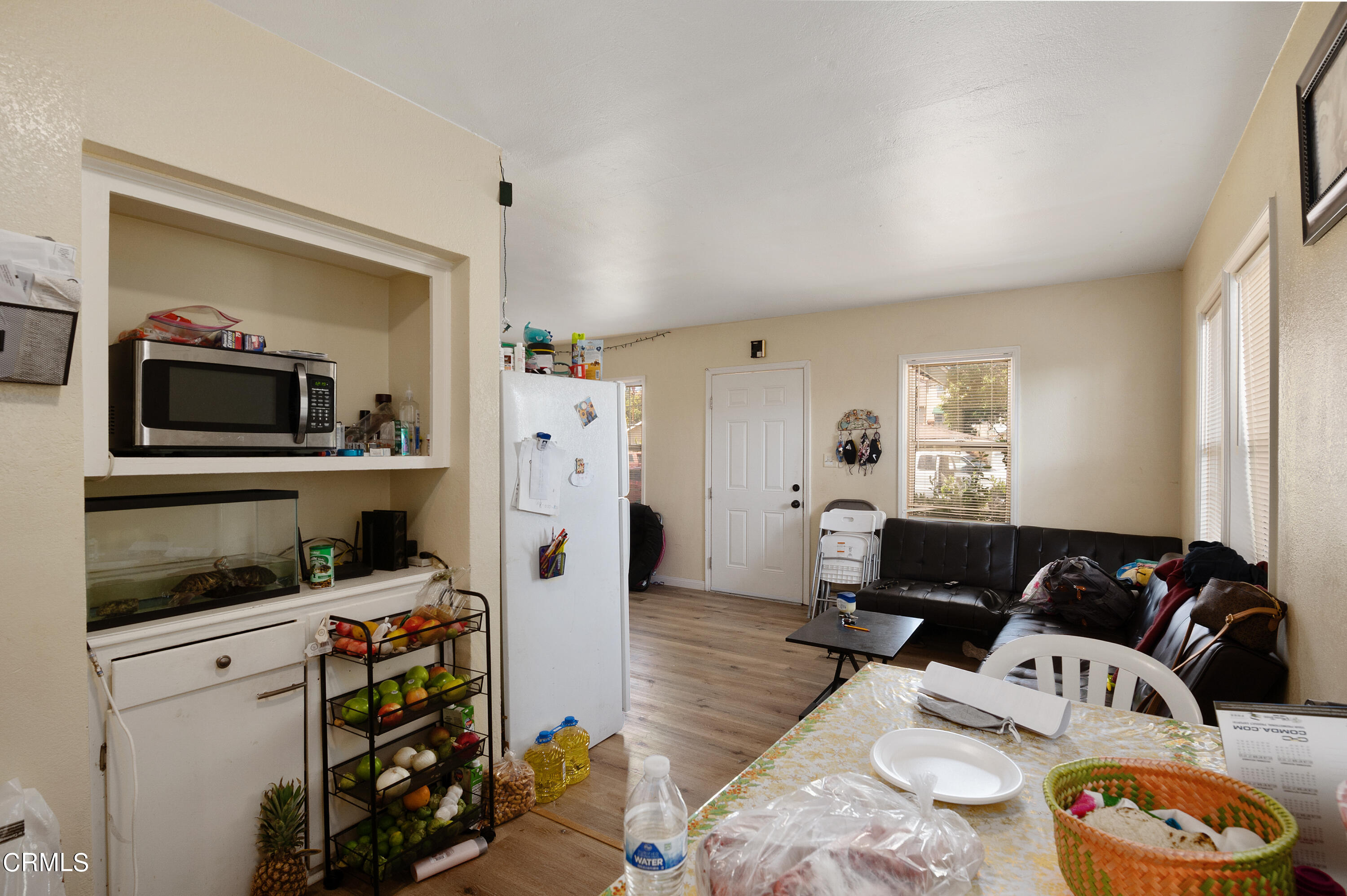 11208 Aster Street Ventura, CA 93004 - Photo 7 of 33 a living room with furniture and a flat screen tv