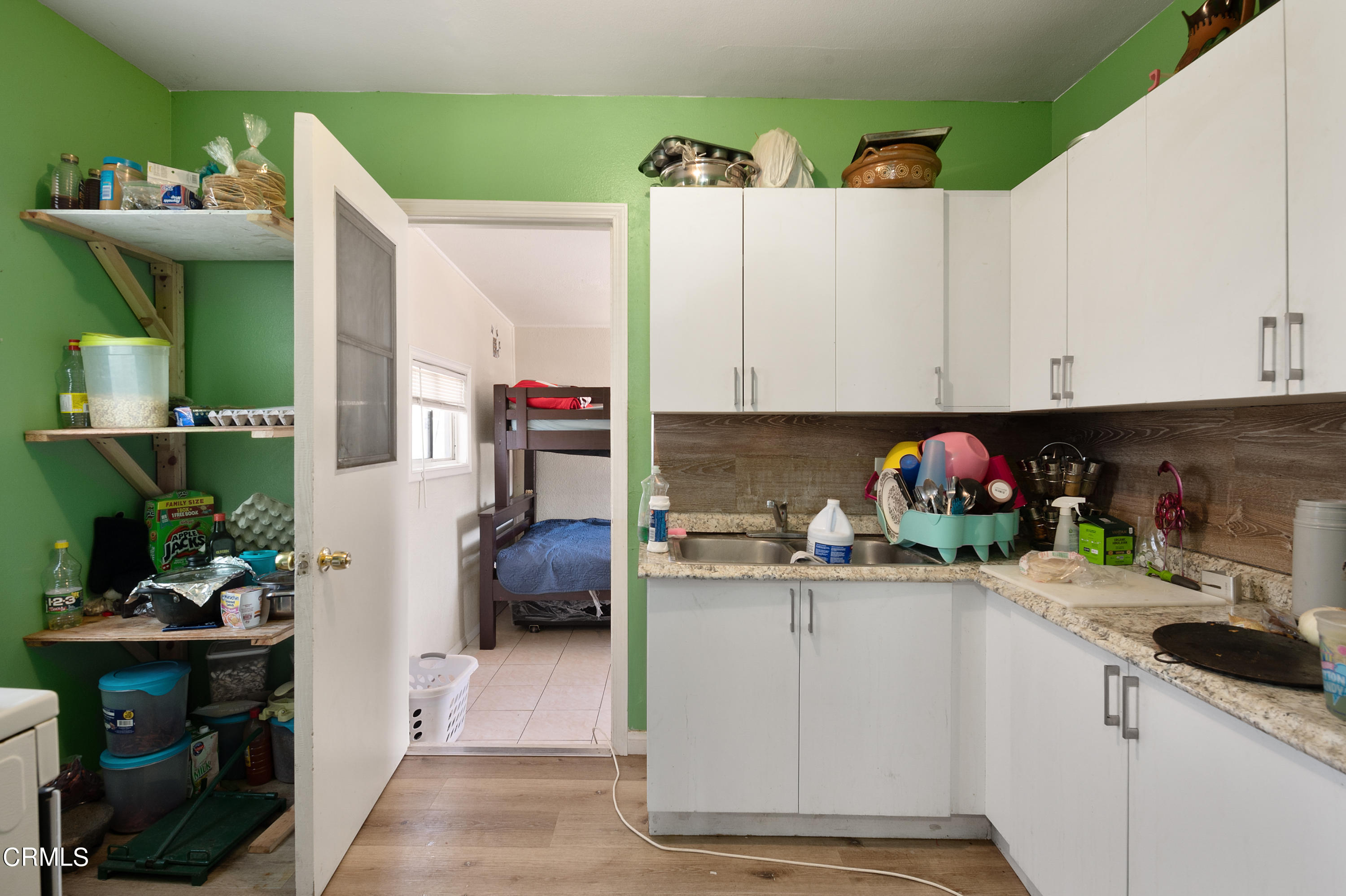 11208 Aster Street Ventura, CA 93004 - Photo 8 of 33 a kitchen with a sink and cabinets