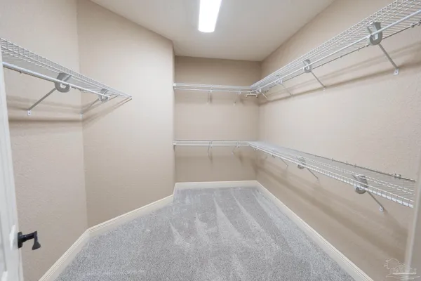a view of a room with racks on the wall