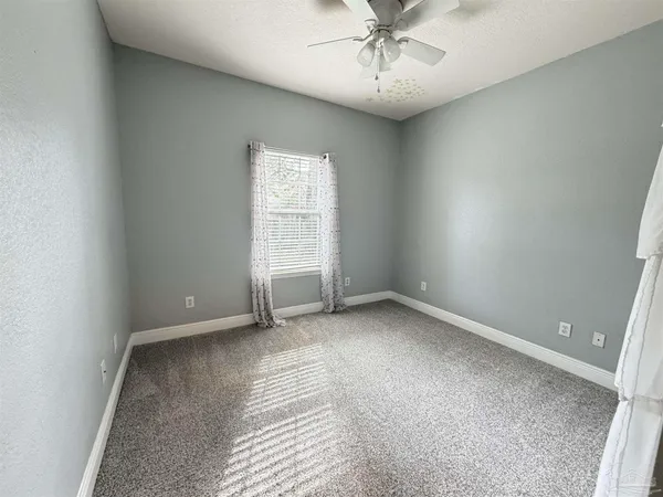 an empty room with a empty space and a window