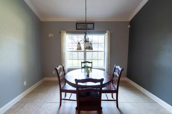 a view of a dining room with furniture window and outside view