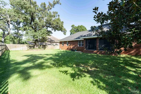 a view of a house with a yard porch and sitting area