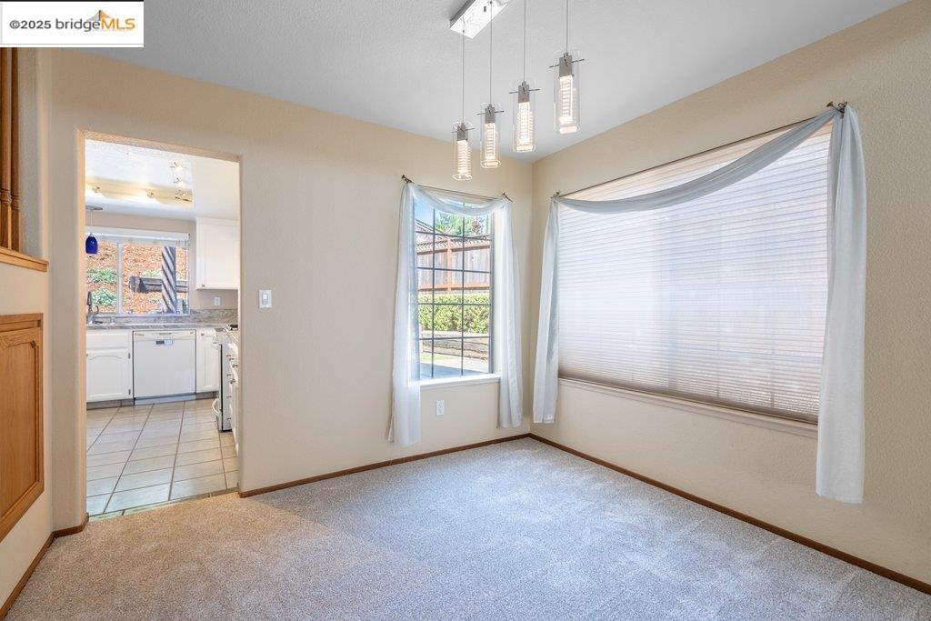 1003 Linda Vista Way Rio Vista, CA 94571 - Photo 11 of 60 Unfurnished dining area featuring light carpet and baseboards