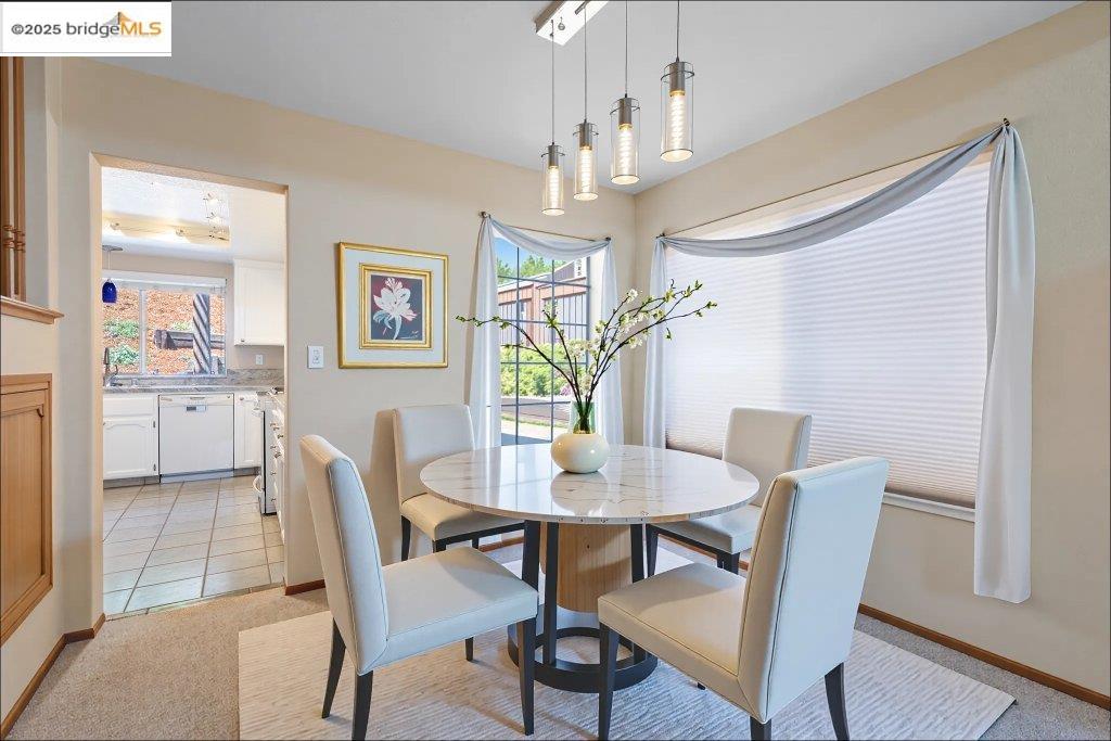 1003 Linda Vista Way Rio Vista, CA 94571 - Photo 12 of 60 Dining space with light colored carpet, plenty of natural light, and light tile patterned floors