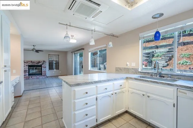a kitchen with stainless steel appliances a sink stove and refrigerator