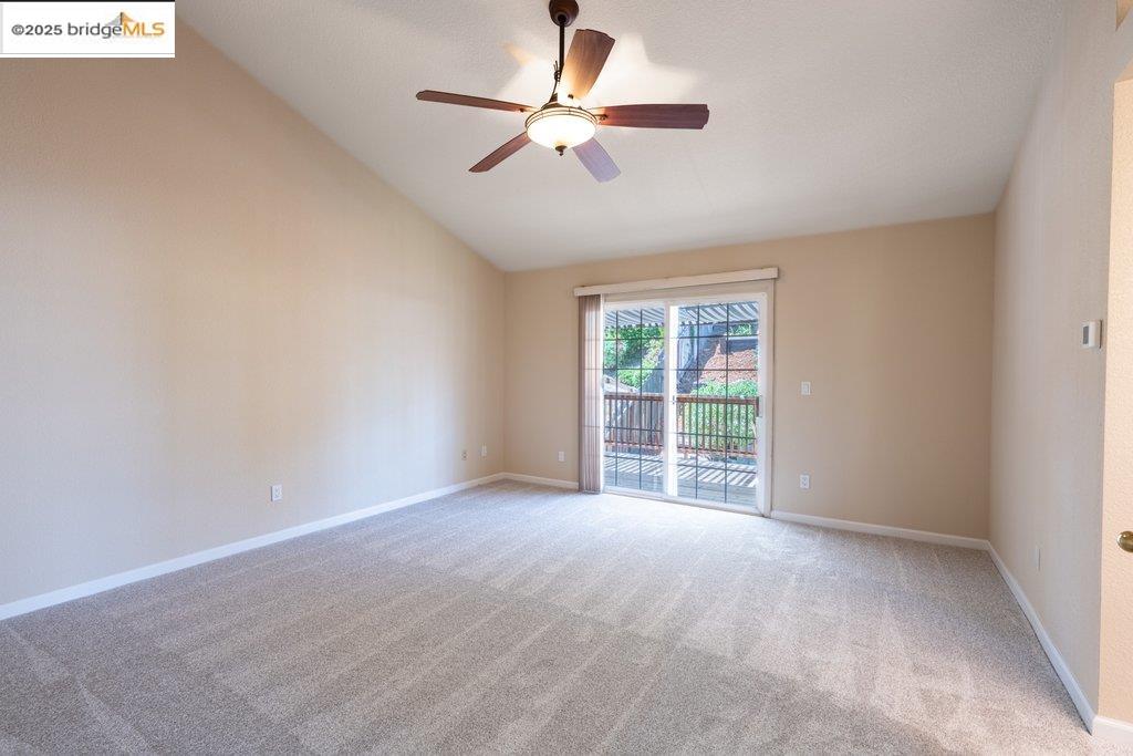 1003 Linda Vista Way Rio Vista, CA 94571 - Photo 28 of 60 Spare room featuring vaulted ceiling, light colored carpet, and a ceiling fan