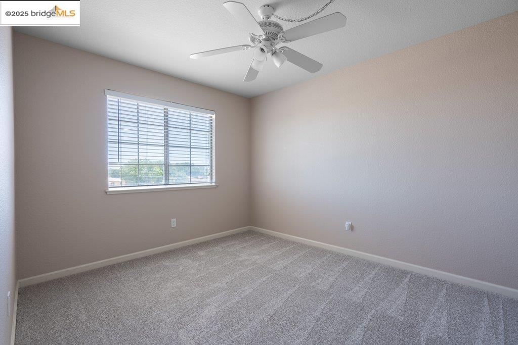 1003 Linda Vista Way Rio Vista, CA 94571 - Photo 44 of 60 Carpeted empty room featuring baseboards and ceiling fan