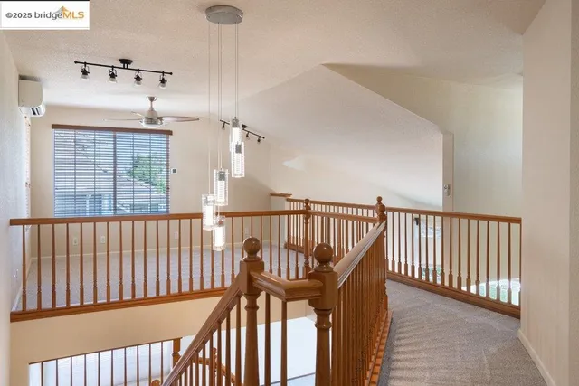 a view of a white house with a large pool and a yard