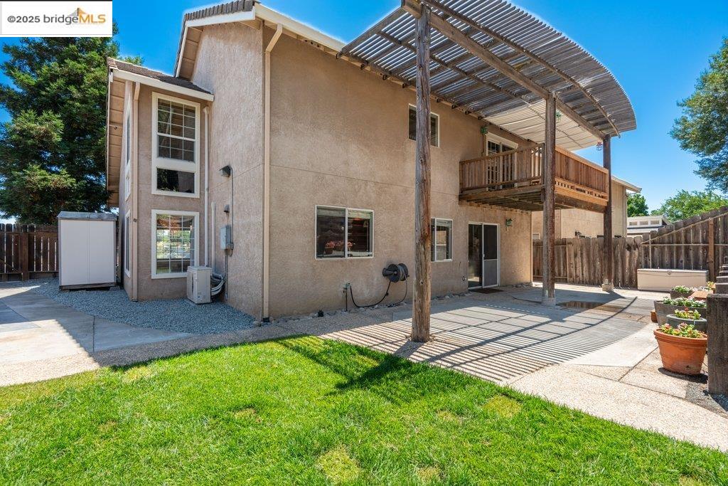 1003 Linda Vista Way Rio Vista, CA 94571 - Photo 50 of 60 Rear view of house with a balcony, a patio, and stucco siding