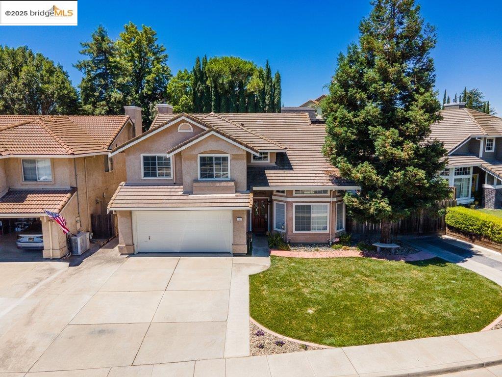 1003 Linda Vista Way Rio Vista, CA 94571 - Photo 54 of 60 Traditional home featuring a tile roof, a chimney, a garage, driveway, and a front yard