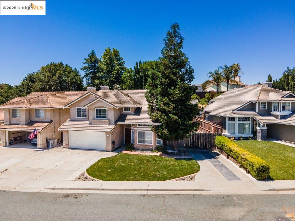 1003 Linda Vista Way Rio Vista, CA 94571 - Photo 55 of 60 Traditional-style house featuring a tiled roof, concrete driveway, stucco siding, an attached garage, and stone siding