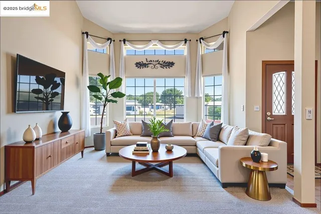 a view of a room with window and hardwood floor
