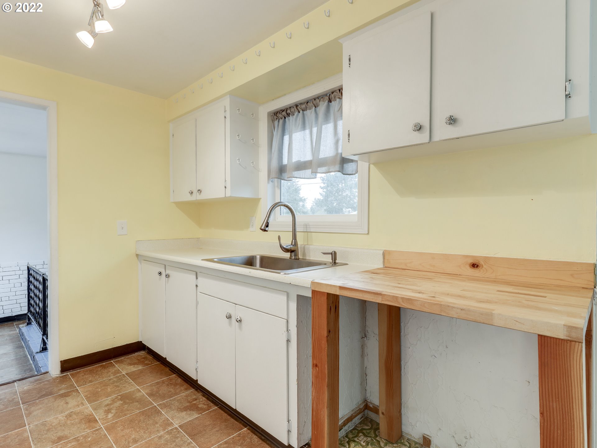 1902 Southeast 151st Avenue Portland, OR 97233 - Photo 11 of 30 a view of a kitchen with a sink
