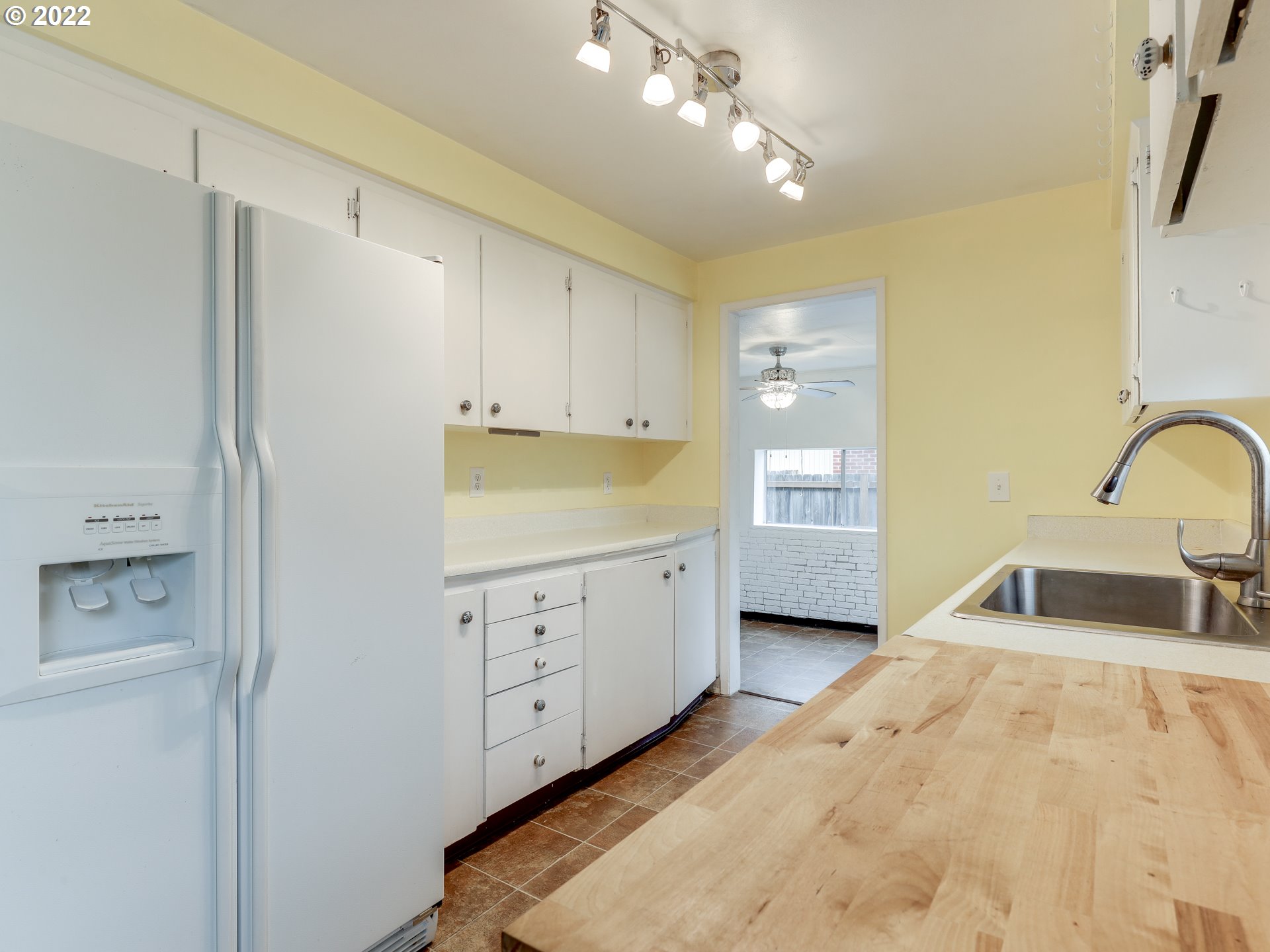 1902 Southeast 151st Avenue Portland, OR 97233 - Photo 12 of 30 a bedroom with a bed and a sink