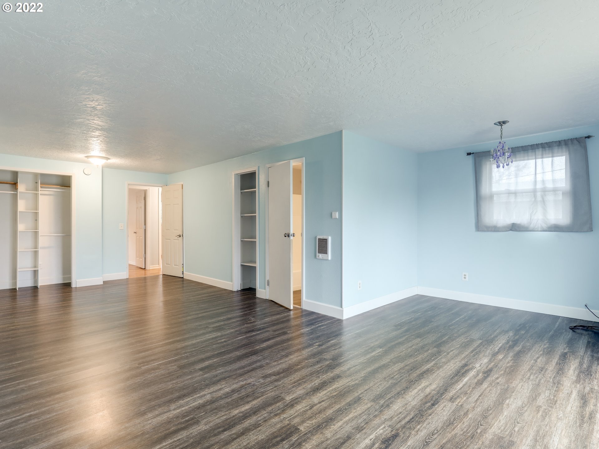 1902 Southeast 151st Avenue Portland, OR 97233 - Photo 15 of 30 an empty room with wooden floor and windows