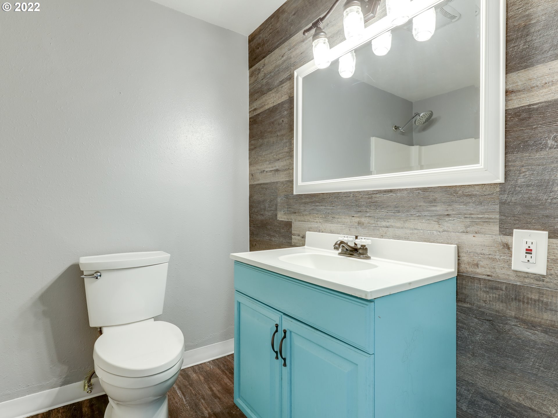 1902 Southeast 151st Avenue Portland, OR 97233 - Photo 17 of 30 a bathroom with a sink a toilet and a mirror