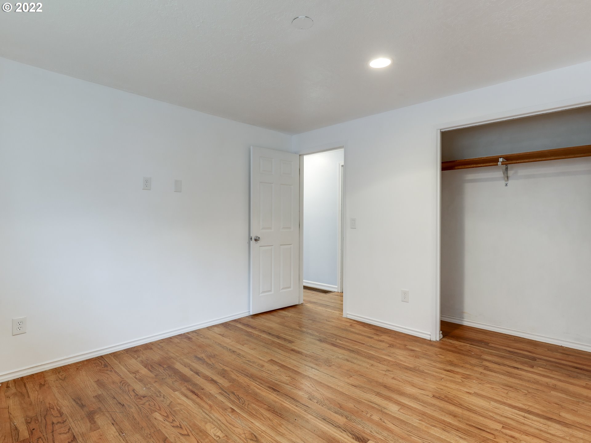 1902 Southeast 151st Avenue Portland, OR 97233 - Photo 19 of 30 a view of an empty room with wooden floor