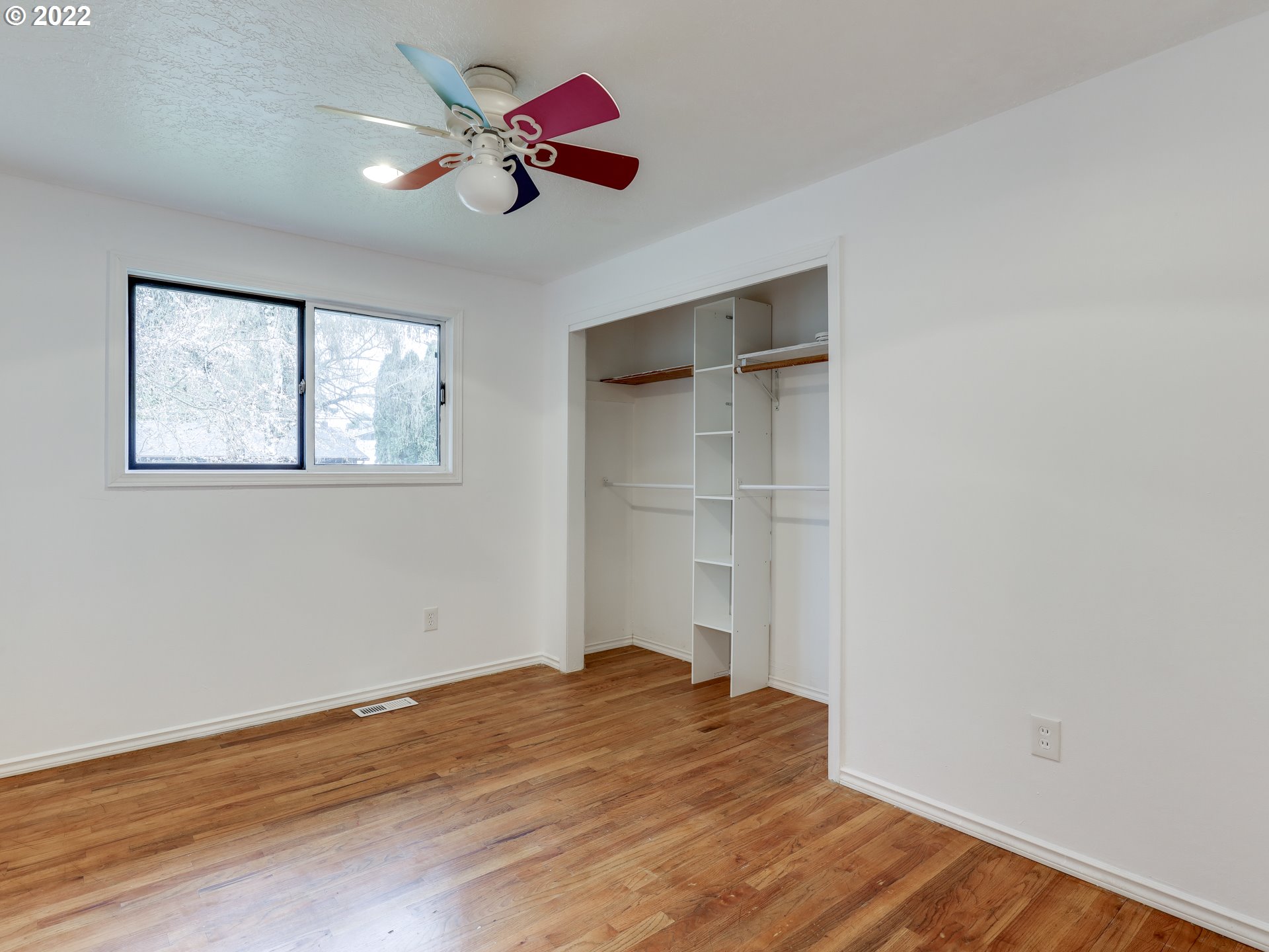 1902 Southeast 151st Avenue Portland, OR 97233 - Photo 22 of 30 a view of empty room with wooden floor and fan