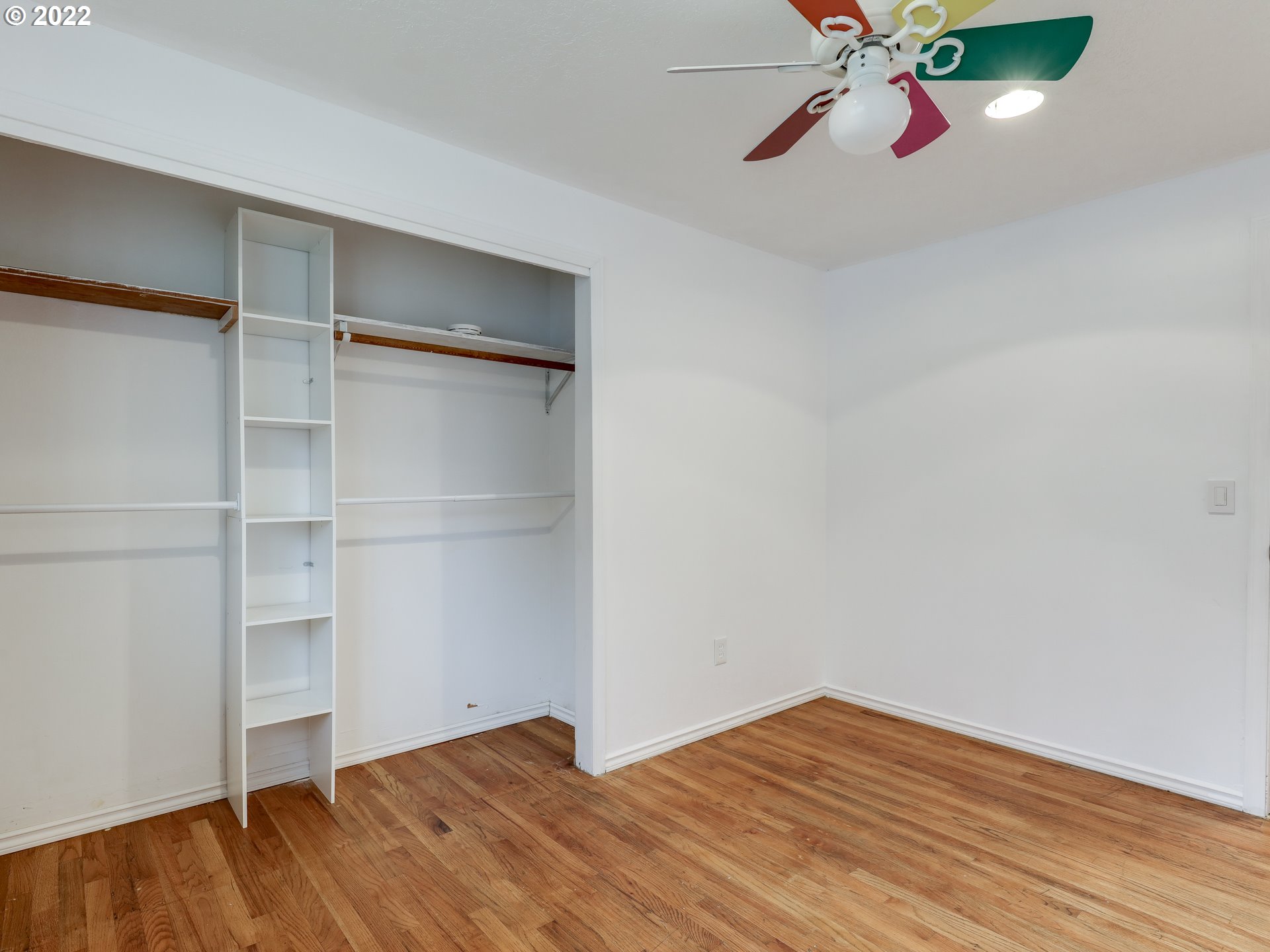 1902 Southeast 151st Avenue Portland, OR 97233 - Photo 23 of 30 a view of an empty room with a window and wooden floor