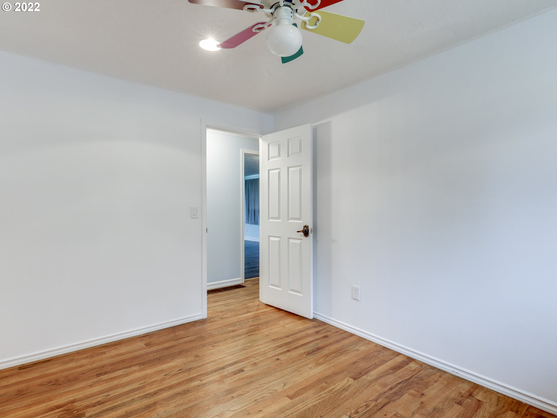 1902 Southeast 151st Avenue Portland, OR 97233 - Photo 24 of 30 a view of an empty room with wooden floor