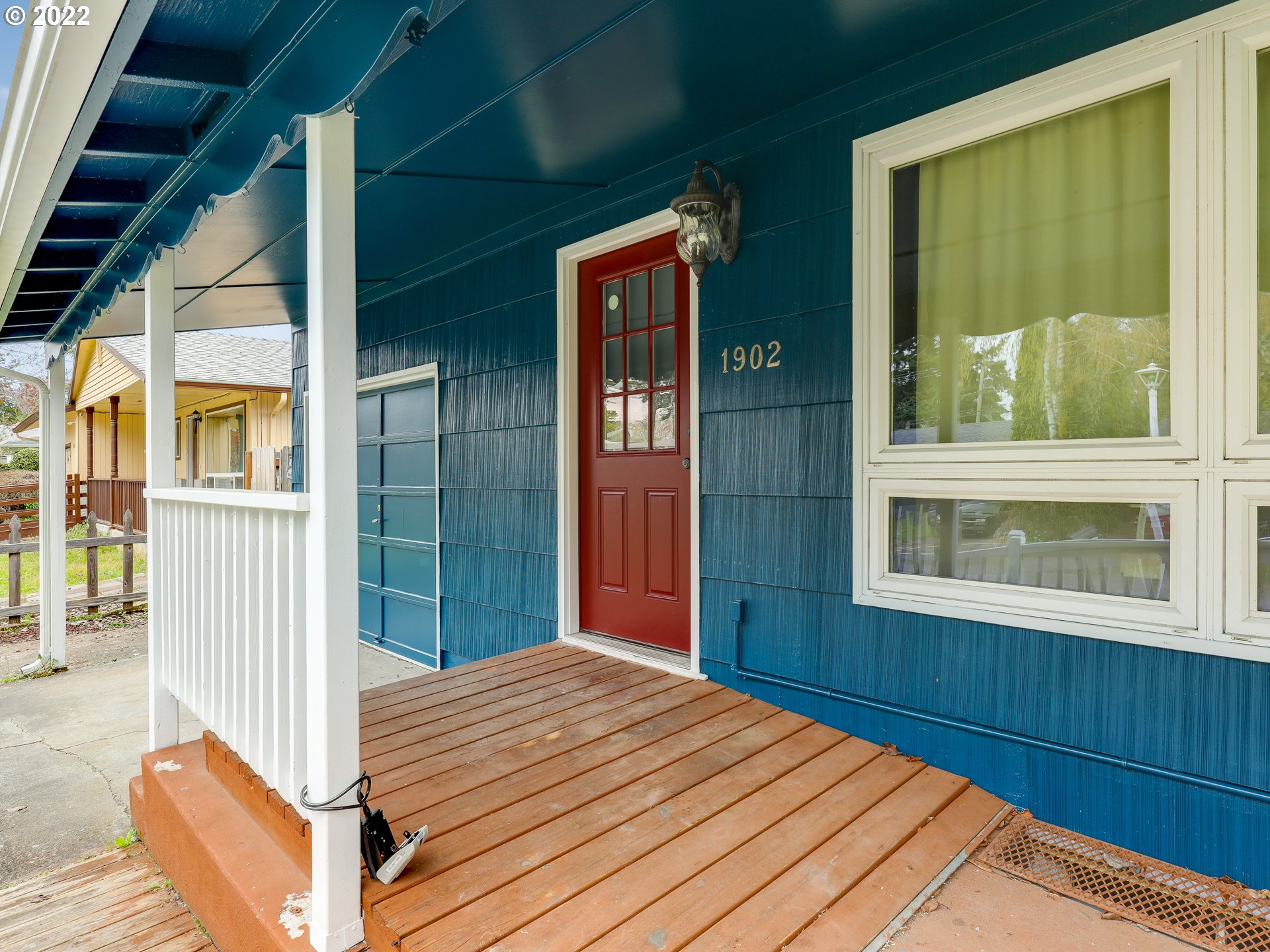 1902 Southeast 151st Avenue Portland, OR 97233 - Photo 4 of 30 a view of a bedroom with wooden floor and windows