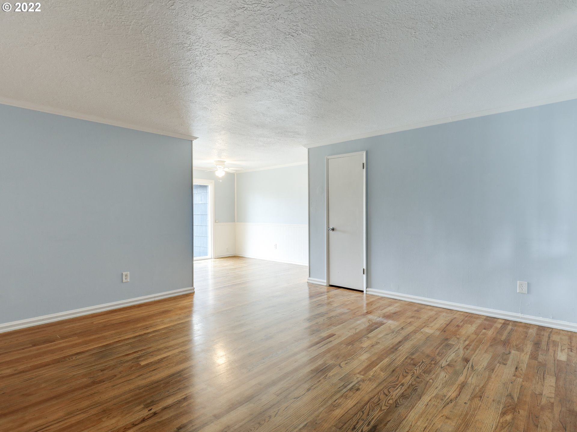 1902 Southeast 151st Avenue Portland, OR 97233 - Photo 8 of 30 a view of an empty room with wooden floor