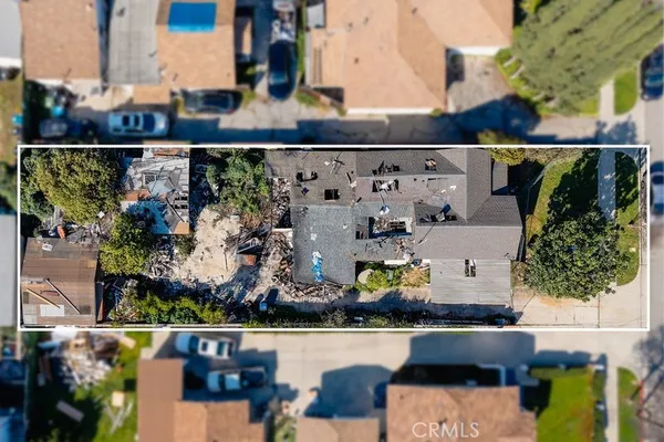 an aerial view of houses with outdoor space