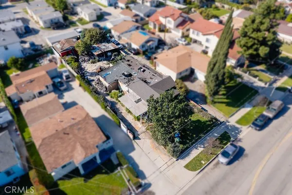 an aerial view of residential house with outdoor space and swimming pool
