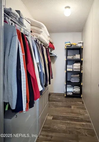 a view of a living room with white walls
