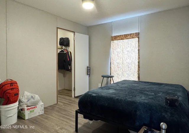 a picture of a bathroom with a sink and mirror