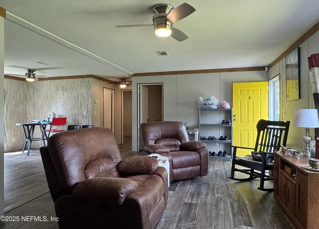 a bedroom with a bed and a book shelf