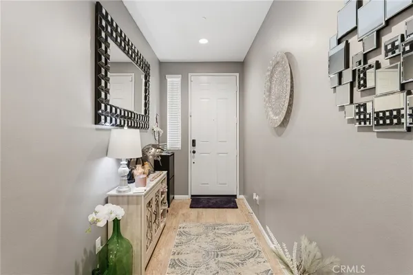 a view of an entryway with wooden floor and stairs