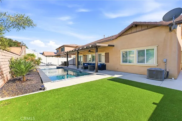 a view of swimming pool with outdoor seating