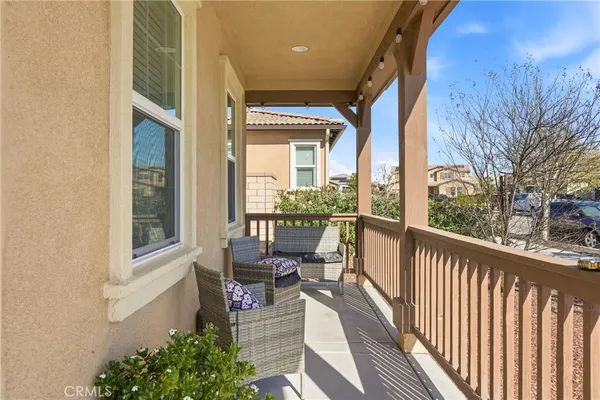 a view of an house with backyard porch and sitting area