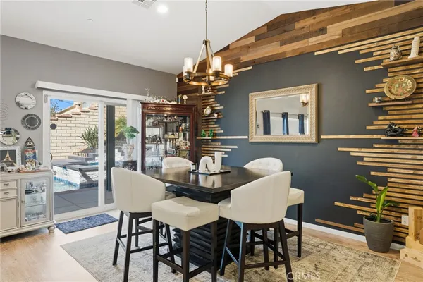 a large kitchen with stainless steel appliances kitchen island granite countertop a stove a sink a refrigerator and a cabinets