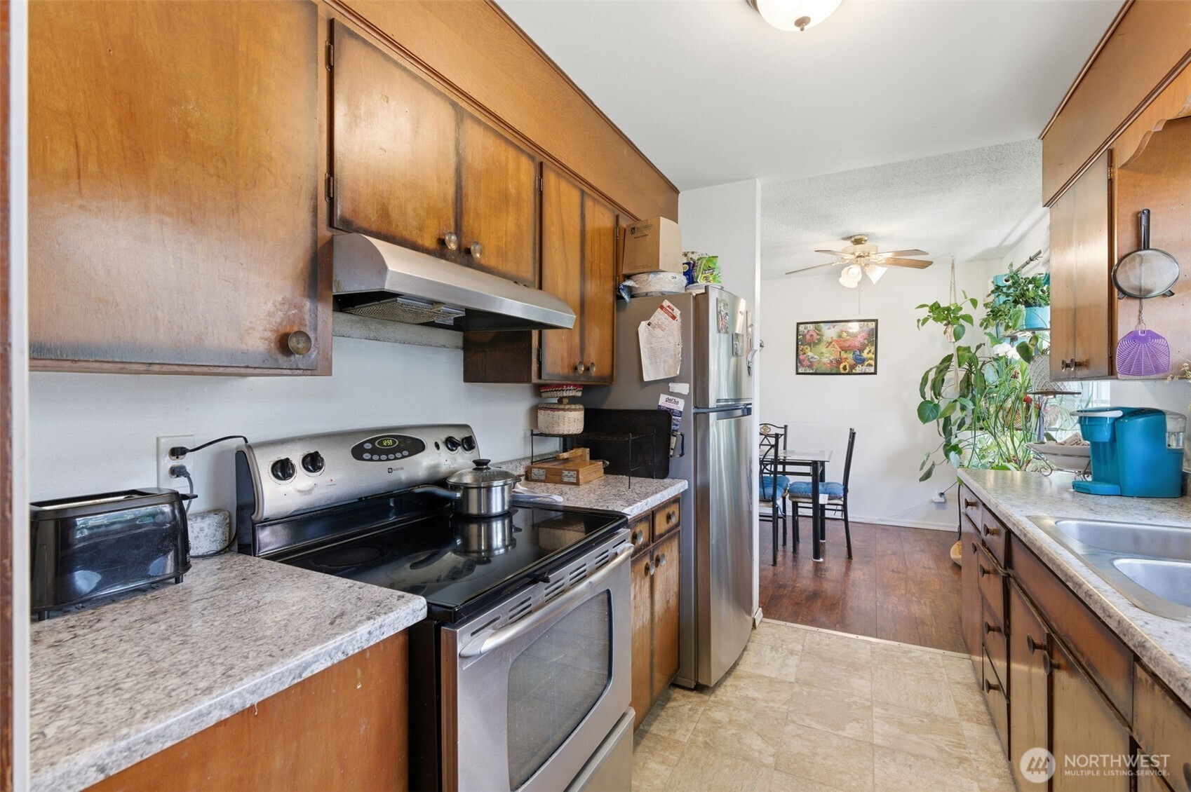 3017 Galvin Road, Unit A Centralia, WA 98531 - Photo 19 of 39 a kitchen with stainless steel appliances granite countertop a sink a stove and a refrigerator