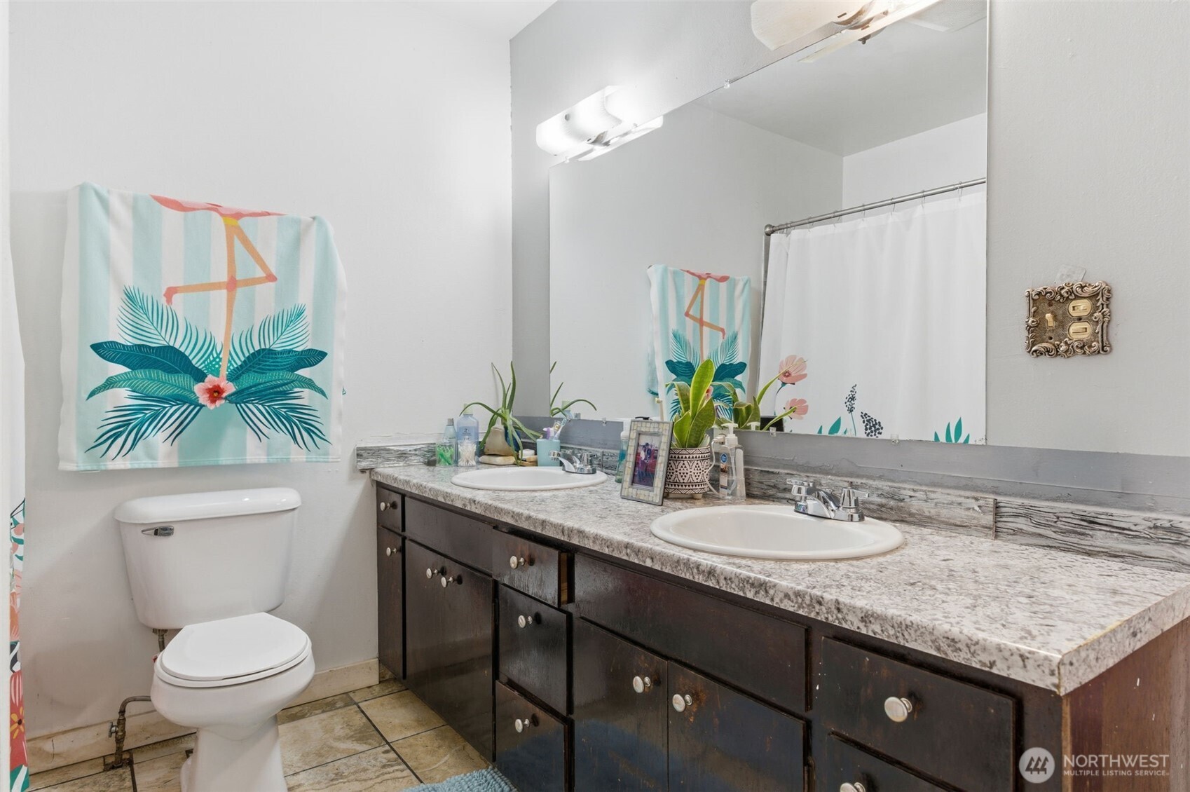 3017 Galvin Road, Unit A Centralia, WA 98531 - Photo 21 of 39 a bathroom with a granite countertop sink a toilet and a mirror