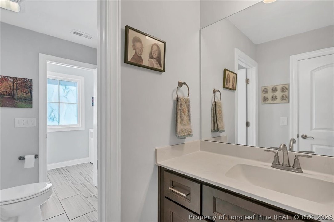 10 Heatherspring Way Spring Lake, NC 28390 - Photo 42 of 48 a bathroom with a sink and a mirror
