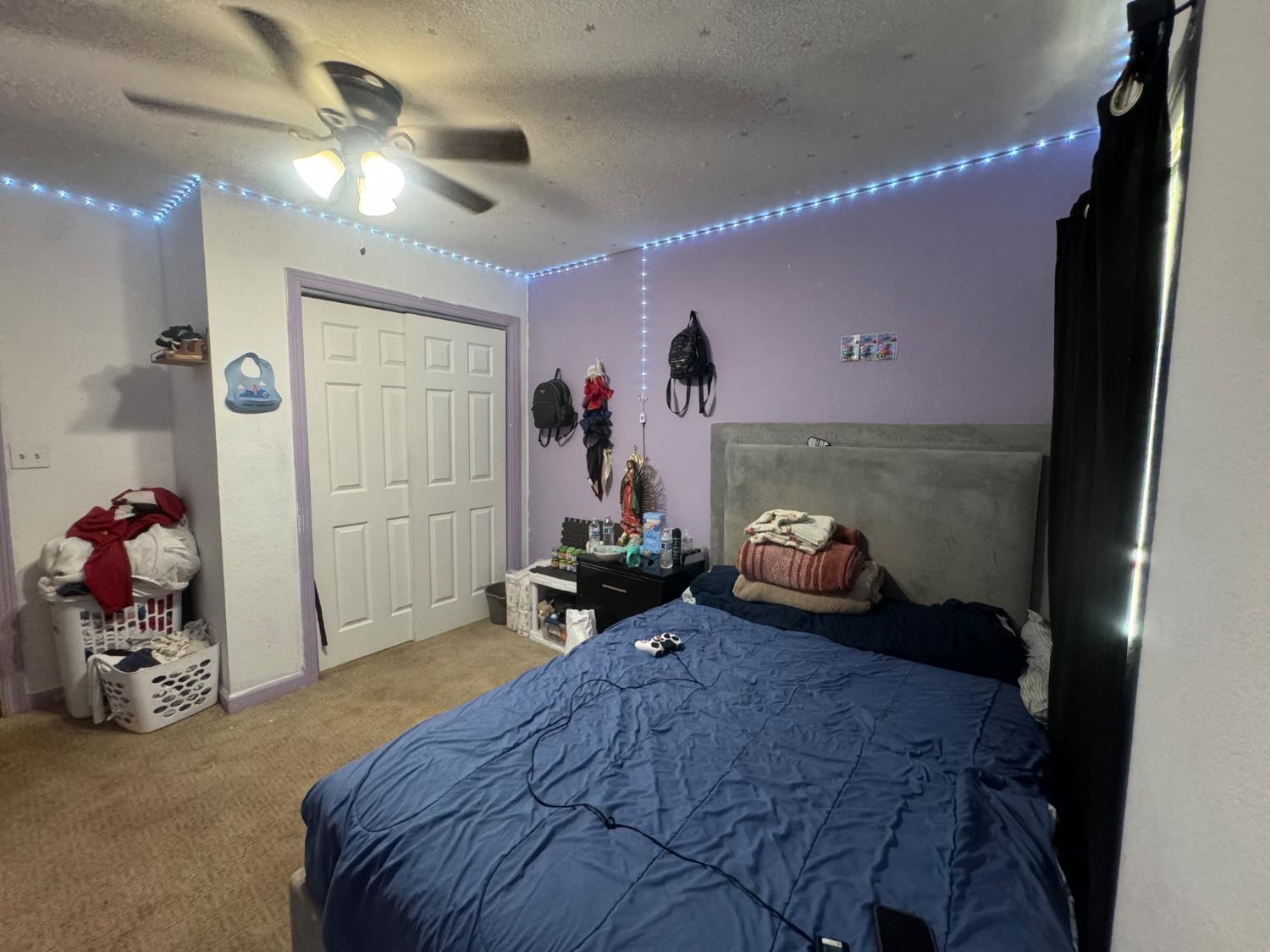 1514 Eureka Street Modesto, CA 95358 - Photo 11 of 14 a bedroom with bed and a large mirror