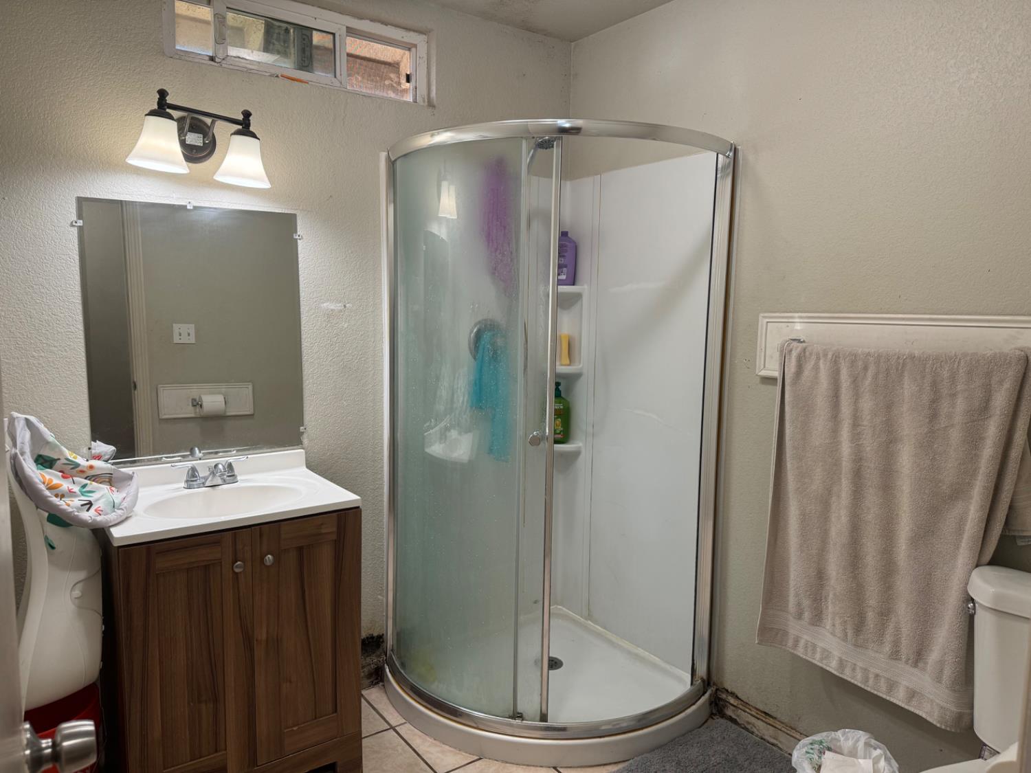1514 Eureka Street Modesto, CA 95358 - Photo 12 of 14 a bathroom with a sink and mirror