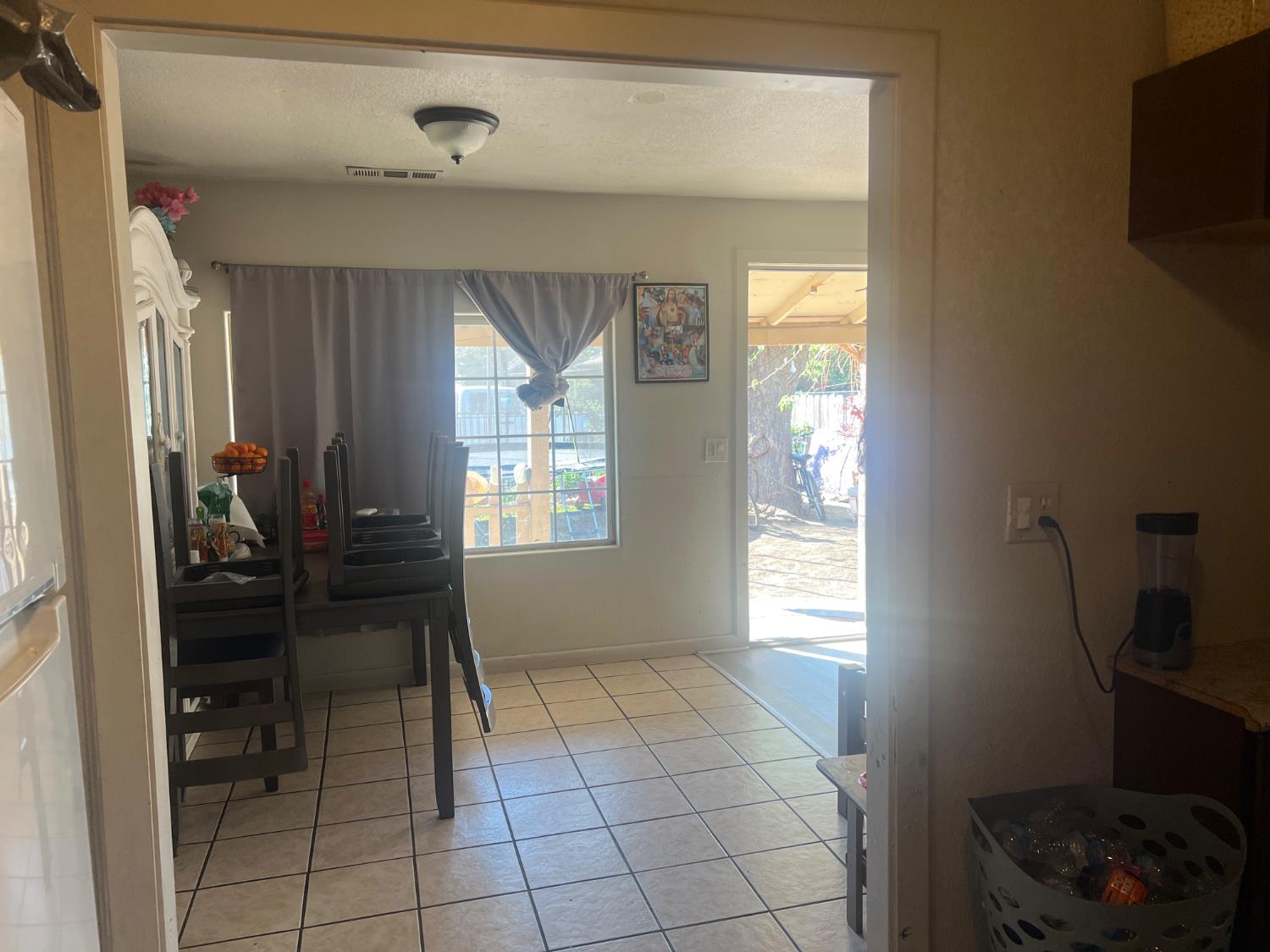 1514 Eureka Street Modesto, CA 95358 - Photo 2 of 14 a view of a hallway to a livingroom with furniture