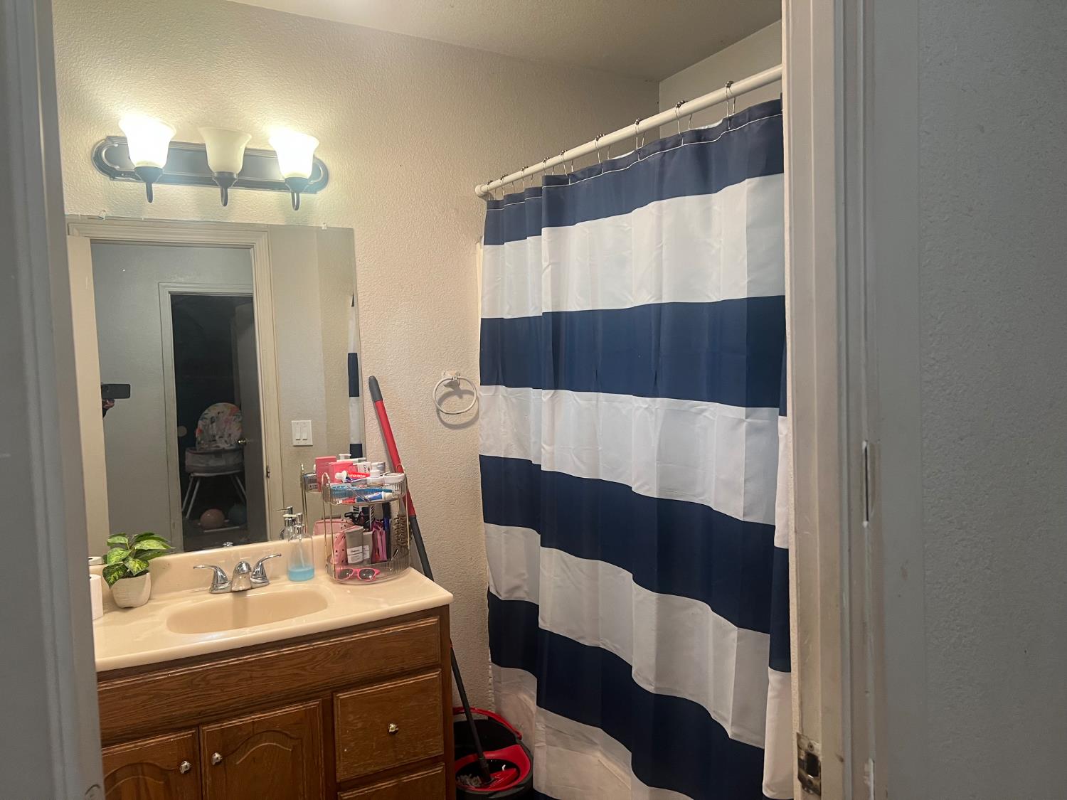 1514 Eureka Street Modesto, CA 95358 - Photo 5 of 14 a bathroom with a sink and a mirror