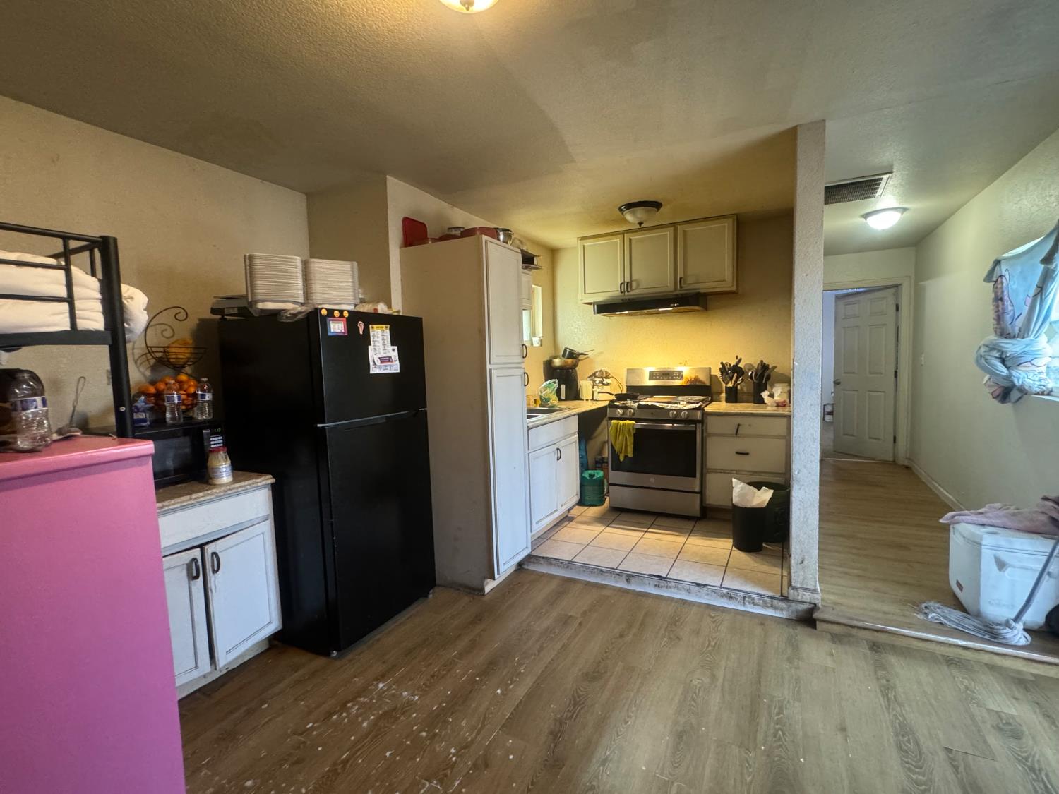 1514 Eureka Street Modesto, CA 95358 - Photo 9 of 14 a kitchen with stainless steel appliances granite countertop a refrigerator a stove and a sink
