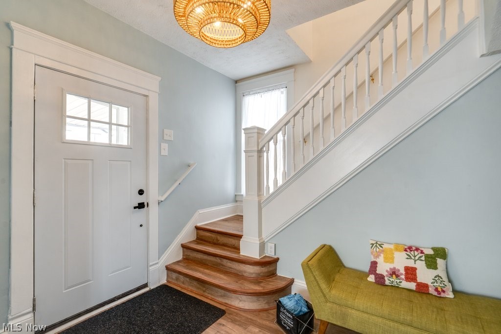 12 South 4th Street Rittman, OH 44270 - Photo 8 of 48 Foyer with wood finished floors and a textured ceiling